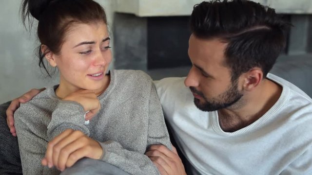 Scaled up look on adorable couple having pleasant conversation