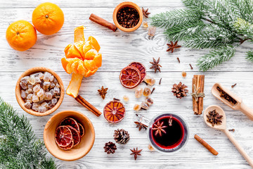 Celebrate new year winter evening with hot drink. Mulled wine or grog ingredients. White background top view.