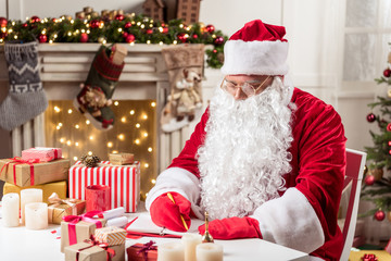 Santa Claus writing in notebook