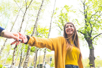 Fototapeta premium Happy woman walking with her girlfriend and smiling