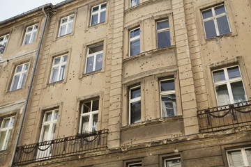 Building with bullet holes of war