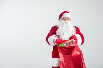 Santa Claus carry a bag full of presents