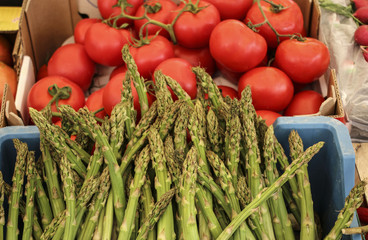 Asparagus and tomatoes on one of the farmers markets in Rome, Italy