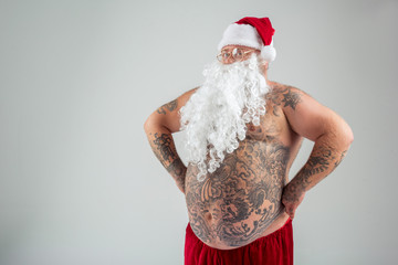 Bearded man in Christmas costume is proud of his appearance