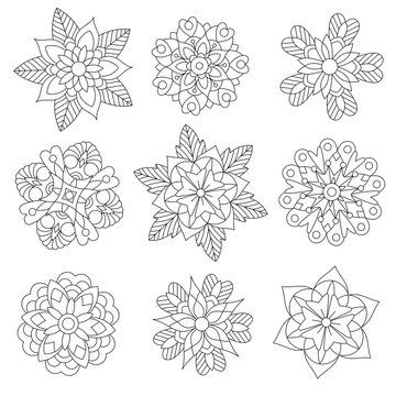 Coloring page of christmas floral decorations. Collection of snowflakes. Freehand sketch drawing for adult antistress coloring book in zentangle style.