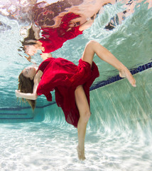 Beautiful young women in a swimsuit, or mermaids tail above and below the water.