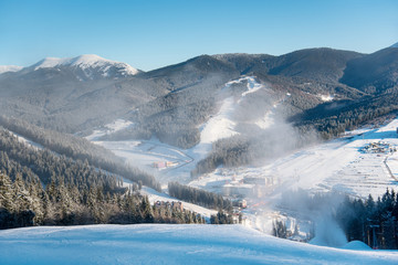 Beautiful morning landscape, nature, ski slopes, ski resort in the winter Carpathian mountains. Bukovel, Ukraine