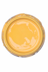 Yellow paint can lid isolated on white background, top view