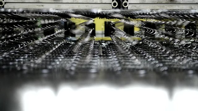 Machine is made for a block of springs orthopedic mattress. At factory mechanism collects metal rods in a row into a common product.