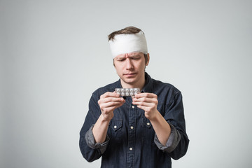 Man with bandage on his head