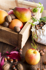 Autumn fruits in a wooden box