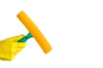 Cleaner's hand holding a squeegee for window glass cleaning isolated on the white background. Early spring windows cleaning.