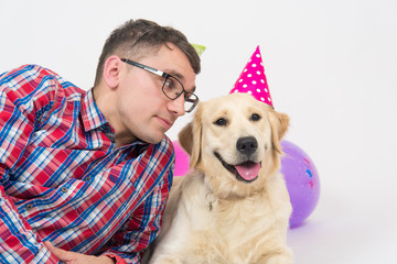 happy birthday dog with family in birthday hats