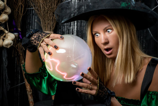 The surprised witch saw in the magic ball his future