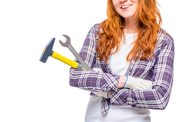 Female hands with male tools close-up on a white background