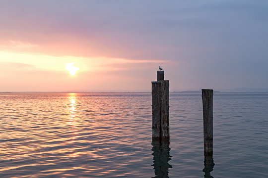Spectacular Sunset over Lake Garda, Lazise: Tranquil Evening Beauty and Golden Reflections