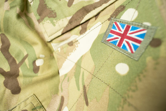 Union Jack / Union Flag Badge On A British Army Camouflage Uniform. Text / Writing / Copy Space Surrounding Badge.
