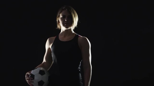 Athletic woman playing soccer