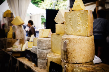 traditional hard cheese on a market stall in Italy