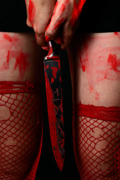 Woman Wearing Red Stockings Holding Bloody Knife