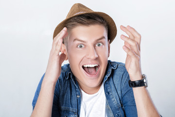 handsome man in denim with hat