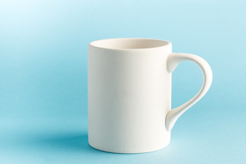 White Mug on Blue Background