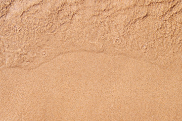 Clear sand and shallow water ripple