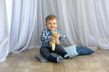 Portrait of a happy young little child boy at home