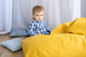 Fototapeta premium Portrait of a happy young little child boy at home