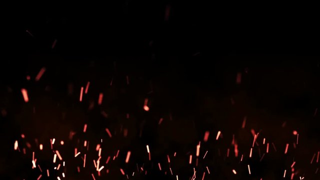 Beautiful fire sparks in the night, dark background. Loop animation.