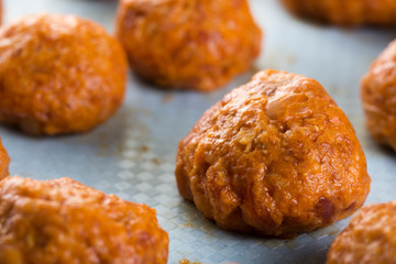 Closeup macro homemade minced meat meatballs ready for baking