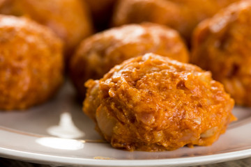 Selective focus on raw minced meat meatballs on the plate
