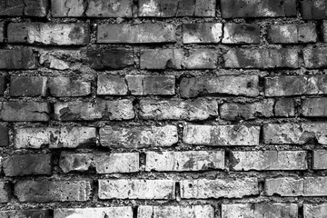 Brick wall. The color is black and white. Background.