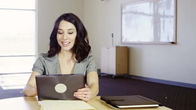 Woman using tablet to work