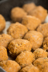 Homemade raw minced meat meatballs on the baking tray