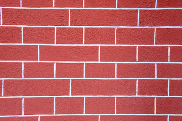 Background from brick wall. The structure of bricks. Pink textured fence. Architectural walls are handmade.