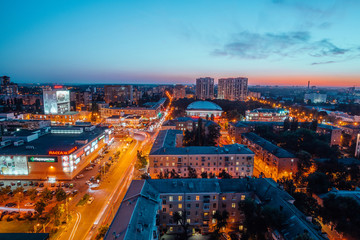 Fototapeta na wymiar Voronezh, Russia - September 17, 2017: Aerial night view of Voronezh downtown. Kirov street, modern buildings, shops, business center, circus