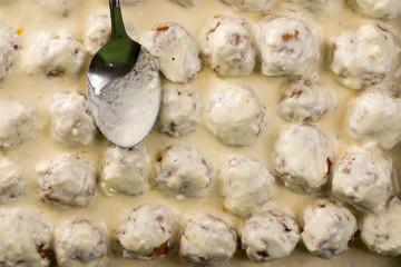 Homemade minced meat meatballs with yogurt ready for baking