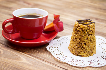 a cup of coffee and a cake