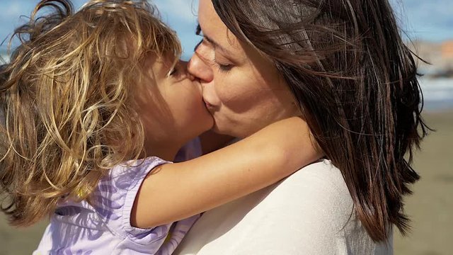 mother daughter french kissing 