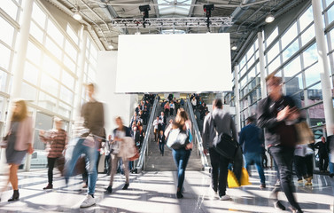 crowd of anonymous blurred business people at a trade fair 