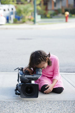 Little Girl Playing With Television Camera