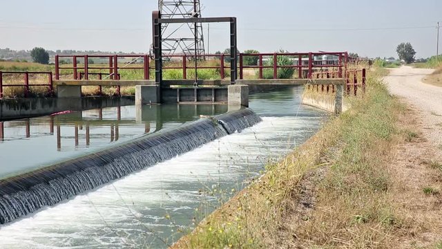 irrigation watercourse canal and a sluicegate