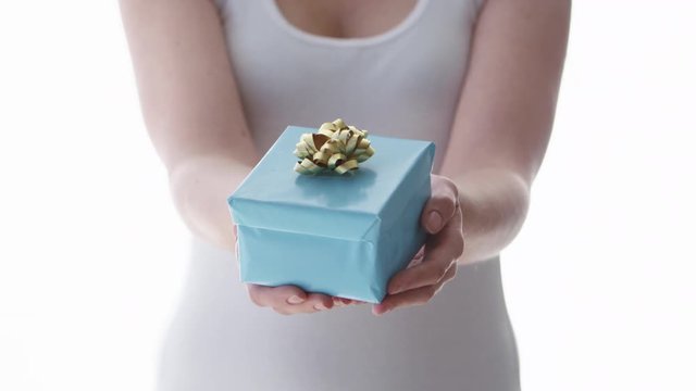 Woman holding gift box present