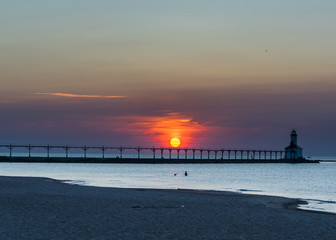 sunset at the pier and lighthouse