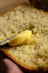 Buttering a Slice of Fresh Bread