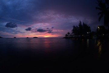 Fototapeta na wymiar Silhouette sunset of tropical beach on background Thailand.