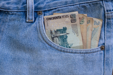 Argentinian money notes in the pocket of the pants