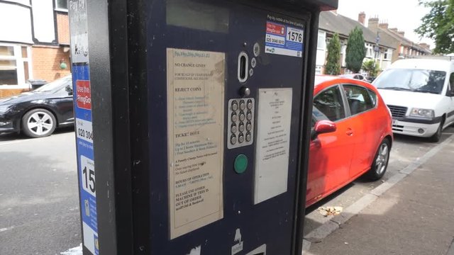 Parking payment terminal. A man pays for parking.
