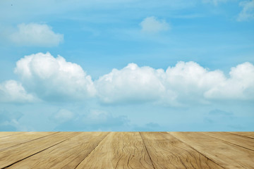 Empty top wooden table on cloud sky nature background